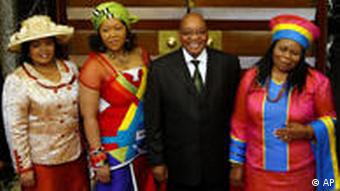 In this June 3, 2009 file photo, South African president Jacob Zuma, second right, seen with his wives Sizakele Khumalo, right, Nompumelo Ntuli, left, and Tobeka Madiba, second left, after giving the State of the Nation address, at parliament in Cape Town, South Africa. The South African president's office on Sunday, Jan. 3, 2010 said he is set to marry Madiba in a formal wedding ceremony this week. (AP Photo/Mike Hutchings, Pool, File)