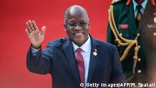 Tanzanian President John Pombe Magufuli gestures while arriving at the Loftus Versfeld Stadium in Pretoria, South Africa, for the inauguration of Incumbent South African President Cyril Ramaphosa on May 25, 2019. (Photo by Michele Spatari / AFP) (Photo credit should read MICHELE SPATARI/AFP/Getty Images)