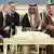Russian President Vladimir Putin and Saudi King Salman in discussions, with interpreters on October 14, 2019.