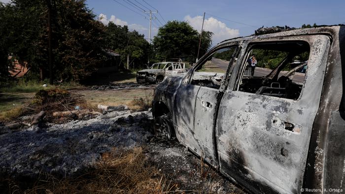 Burnt wreckages of police patrol cars in Mexico