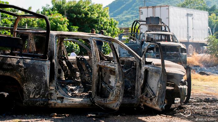 Picture of police vehicles torched by gunmen who also killed 14 police officers in an ambush in the community of Aguililla, in the Mexican state of Michoacan, 