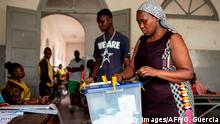 A woman casts her ballot at a school during the Mozambican General Elections on October 15, 2019 in Maputo, Mozambique. (Photo by GIANLUIGI GUERCIA / AFP) (Photo by GIANLUIGI GUERCIA/AFP via Getty Images)