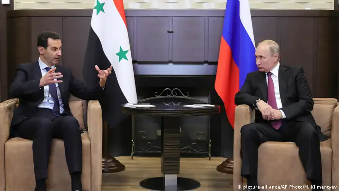 Russia has consistently backed the government of Syrian President Assad (L, with Putin in 2018) and assisted its forces. After US troops pulled out of the Kurdish areas, Russia moved its troops in to act as a buffer for Syrian government forces advancing towards the Turkish army. Moscow wants Syria to remain united and has accused the US of creating parallel structures in the Kurdish region.