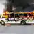 A burning bus blocks a road in Culiacan, Mexico, after being set alight by cartel members following the attempted detention of Ovidio Guzman
