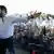 Salvini spreads his arms in front of a crowd in Rome