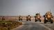 US tanks drive down the road in Syria US tanks drive down the road in Syria