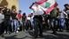 Protesters with Lebanese flag in Beirut Protesters with Lebanese flag in Beirut