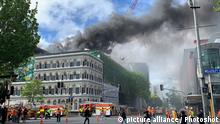 (191022) -- AUCKLAND, Oct. 22, 2019 () -- Photo taken on Oct. 22, 2019 shows the accident site of a fire in Auckland, New Zealand. A massive fire broken out Tuesday afternoon at a construction site in New Zealand's Auckland City center has left one missing and another seriously injured. A Fire and Emergency spokesman told media that one person was unaccounted for, and one person was seriously hurt. It is reported that a major fire has broken out at Auckland's SkyCity convention center construction site on Tuesday afternoon. Emergency services were called to the blaze about 1:10 p.m. local time. (Photo by Han Bo/)