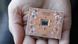 A quantum device is held in the palm of a hand at IBM's research center in New York A quantum device is held in the palm of a hand at IBM's research center in New York