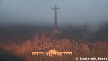 The Valle de los Caidos (The Valley of the Fallen), the state mausoleum where late Spanish dictator Francisco Franco is buried, is seen at dusk in San Lorenzo de El Escorial in this picture taken from Guadarrama, near Madrid, Spain, October 24, 2019. REUTERS/Sergio Perez