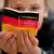 Child reads German Basic Law