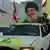 Supporters of Lebanon's Hezbollah leader Hassan Nasrallah ride in a truck decorated with flags and a picture of him in southern Lebanon