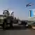 US military convoy drives through the town of Qamishli, in northern Syria
