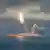 В открытом море из воды в небо взлетает ракета "Булава"