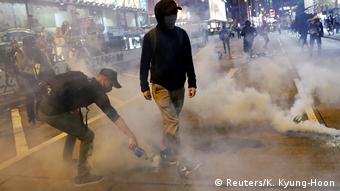 Anti-government protesters in Hong Kong amongst tear gas during demonstration on 31 October 2019.