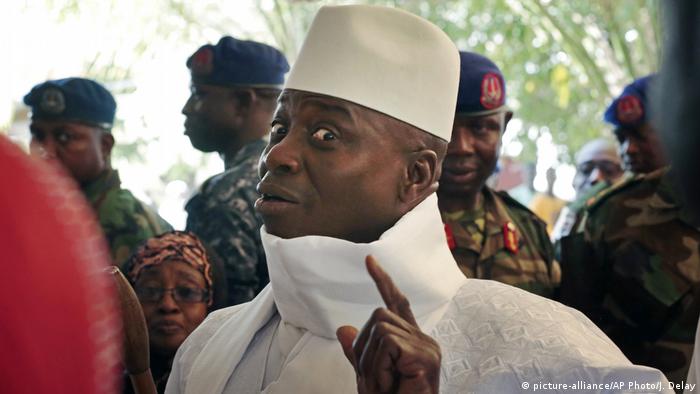 Gambia's former President Yahya Jammeh holds up his index finger