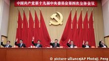 In this photo released by China's Xinhua News Agency, Chinese President Xi Jinping, center, and, from left, Politburo Standing Commitee members Han Zheng, Wang Huning, Li Zhanshu, Premier Li Keqiang, Wang Yang, and Zhao Leji attend the fourth plenary session of the 19th Central Committee of China's ruling Communist Party in Beijing, Thursday, Oct. 31, 2019. (Ju Peng/Xinhua via AP)