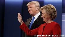 FILE - In this Sept. 26, 2016 file photo, then Republican presidential candidate Donald Trump, left, stands with then Democratic presidential candidate Hillary Clinton before the first presidential debate at Hofstra University in Hempstead, N.Y. Gearing up to take on Democratic front-runner Joe Biden, President Donald Trump sees echoes of his original political foe, Hillary Clinton. (AP Photo/ Evan Vucci) |