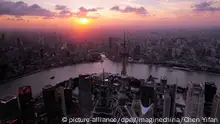 Picture taken from the Shanghai World Financial Center shows the skyline at night of Puxi, Huangpu River and the Lujiazui Financial District with skyscrapers and high-rise buildings in Pudong, Shanghai, China, 24 July 2012. Photo: Chen Yifan/Imaginechina |