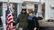 Tourists stands next to US soldier re-enactor at Checkpoint Charlie Tourists stands next to US soldier re-enactor at Checkpoint Charlie