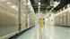 A man in a yellow suit walks down a metal-lined corridor in Fordow nuclear plant A man in a yellow suit walks down a metal-lined corridor in Fordow nuclear plant