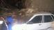 Car damaged by rubble Car damaged by rubble