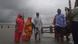 People wade through the water in West Bengal state as Cyclone Bulbul approaches People wade through the water in West Bengal state as Cyclone Bulbul approaches