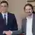 Pedro Sanchez stands on the left shaking the hand of Pablo Iglesias on the right
