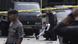 Members of police forensic team inspect the site of a bombing attack at the local police headquarters in Medan Members of police forensic team inspect the site of a bombing attack at the local police headquarters in Medan