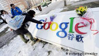 A young Chinese woman lays flowers on the logo of Google in front of the headquarters of Google China in Beijing, China, 13 January 2010. Googles threat to quit China over censorship and hacking intensified Sino-U.S. frictions on Wednesday (13 January 2010) as Washington said it had serious concerns and demanded an explanation from Beijing. China has not made any significant comment since Google, the worlds top search engine, said it would not abide by censorship and may shut its Chinese-language google.cn website because of attacks from China on human rights activists using its Gmail service and on dozens of companies. U.S. Commerce Secretary Gary Locke urged China to work with Google and other firms to ensure cyber security, calling the intrusion troubling to the U.S. government and American companies doing business in China