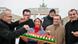 Woman presenting cheese to Chinese vistors in front of the Brandenburg gate Woman presenting cheese to Chinese vistors in front of the Brandenburg gate