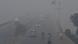 Commuters drive their vehicles amid heavy smog conditions in Lahore Commuters drive their vehicles amid heavy smog conditions in Lahore