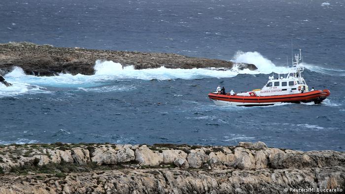 A boat sailing of the shore of Lampedusa