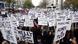 Women in Paris hold placards with the names of women killed by their husband since the beginning of the year Women in Paris hold placards with the names of women killed by their husband since the beginning of the year