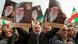 Pro-government protesters in Tehran, Iran, raising national flags and pictures of Iran's supreme leader, Ayatollah Ali Khamenei Pro-government protesters in Tehran, Iran, raising national flags and pictures of Iran's supreme leader, Ayatollah Ali Khamenei