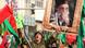 A government supporter chants slogans with ayatollah's picture in the background A government supporter chants slogans with ayatollah's picture in the background