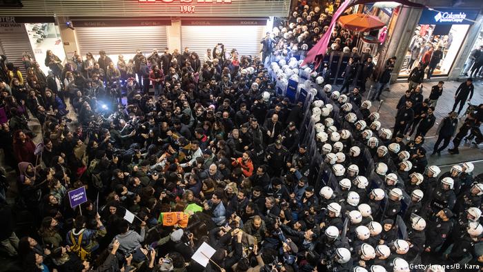 Demonstrators face off against police in Istanbul during a march condemning violence against women