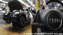 FILE- In this March 24, 2018, file photo, part of the assembly line at German car producer Audi plant in Ingolstadt, Germany. The Ingolstadt-based automaker said Tuesday Nov. 26, 2019, that it expected to add 2,000 new positions while Volkswagen subsidiary Audi says it is cutting 9,500 jobs in Germany through 2025.(AP Photo/Matthias Schrader, File) |