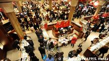 People crowd the aisles inside Macy's department store November 25, 2011 in New York after the midnight opening to begin the Black Friday shopping weekend. AFP PHOTO/Stan HONDA (Photo credit should read STAN HONDA/AFP via Getty Images)