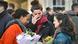Three women hold flowers and wipe away tears during the London attack vigil Three women hold flowers and wipe away tears during the London attack vigil