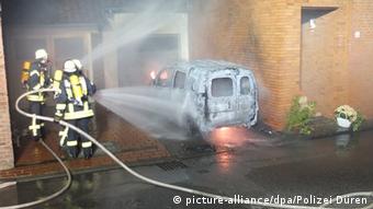 German firefighters extinguish an electric car