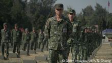 Soldiers stand guard at the cemetery of fallen soldiers during a ceremony commemorating the battle of Guningtou in Kinmen on October 23, 2019. - The tiny Taiwanese island of Kinmen on October 23 marked the 70th anniversary of battle of Guningtou during the 1949 Chinese Civil War, which resulted in the Kuomintang halting the advance of the People's Liberation Army to take the island. (Photo by Sean CHANG / AFP) (Photo by SEAN CHANG/AFP via Getty Images)