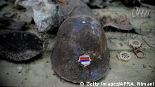 This picture taken on May 17 , 2013 shows a helmet with a Serbian flag as members of the Kosovo Security Force (KSF) search for mines and unexploded devices left from the 1998-99 war between Serb security forces and ethnic Albanian guerrilla, in Pristina. According to reports, 115 people died and 454 other were wounded by mines and unexploded devices since the end of the war in 1999. AFP PHOTO / ARMEND NIMANI (Photo credit should read ARMEND NIMANI/AFP via Getty Images)