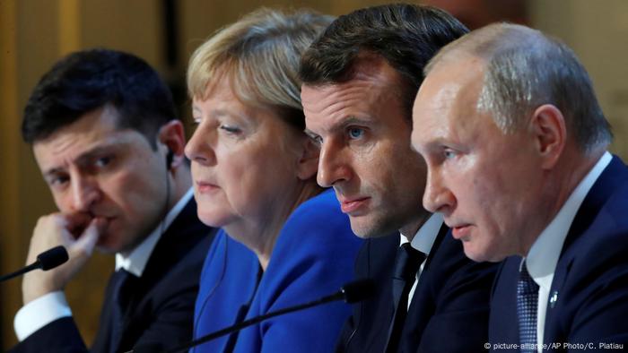 Ukraine's President Volodymyr Zelenskyy, German Chancellor Angela Merkel, French President Emmanuel Macron, and Russian President Vladimir Putin at a joint news conference at the Elysee Palace in Paris