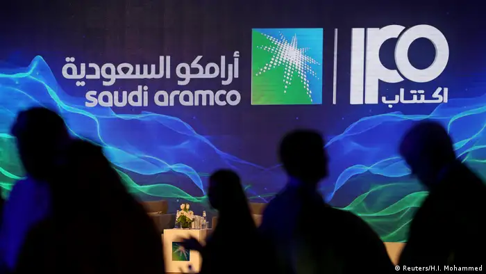 A sign of Saudi Aramco's initial public offering (IPO) is seen during a news conference