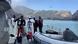 Divers get suited up on the edge of a boat as they prepare to look for White Island victims Divers get suited up on the edge of a boat as they prepare to look for White Island victims