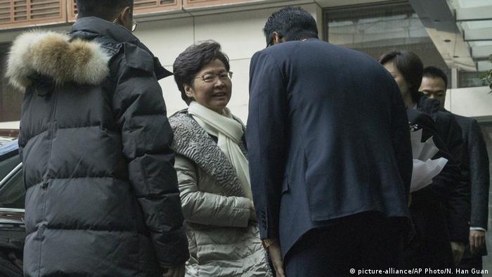  Carrie Lam arrives in Beijing on Saturday wearing a white scarf