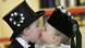 Two young children, dressed in traditional Sorbian wedding clothes, kiss each other during a Sorbian celebration Two young children, dressed in traditional Sorbian wedding clothes, kiss each other during a Sorbian celebration
