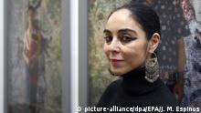 epa02016124 Iranian artist and film maker Shirin Neshat poses during the presentation of her works 'Games of desire' and 'Faezeh', at La Fabrica art gallery in Madrid, Spain, 03 February 2010. The exhibition, that can be seen from 04 February to 20 March, shows 'Games of desire', a video and still-photography piece inspired in the Laos traditions and 'Faezeh', a color video-audio installation based on Shahrnush Parsipur¿s novel Women Without Men. EPA/JUAN M. ESPINOSA |