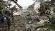 People looking at earthquake damage People looking at earthquake damage